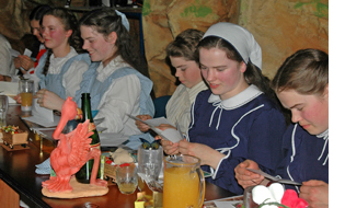 Reading letters of appreciation at a Young Peoples' Tea